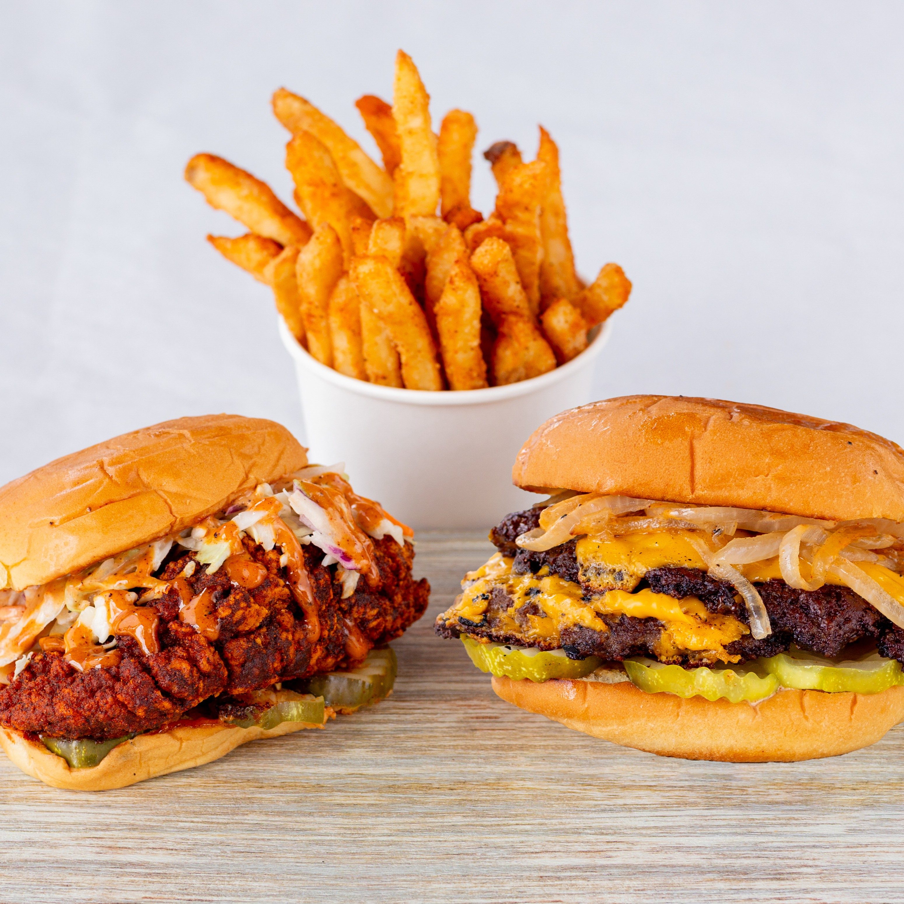 Single wagyu burger, Chicken Sando with fries.